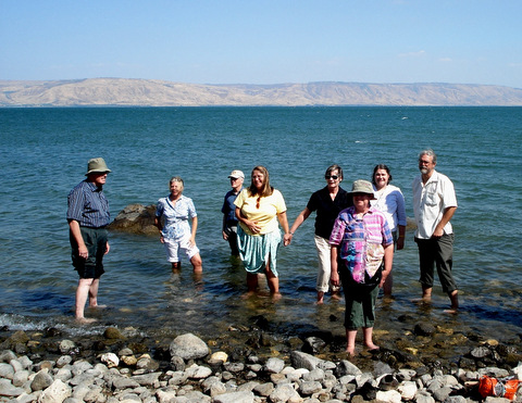 A group of friends from Dallas, TX, wading in the Sea of Galilee. (Photo: Harold Knight, 2008)